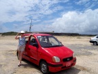  Our red rental sits in front of the prison on Boca Grandi beach, Aruba