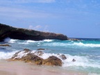  Waves hitting a rocky cove on an Aruban-Carribbean beach