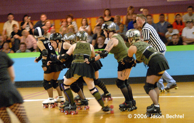  Bex Pistol makes room for her jammer to scoot through and score