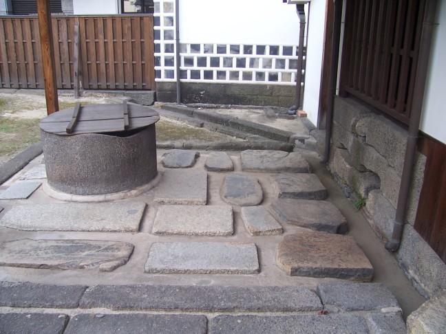  ... and onto terrace of raised flagstones around the real well