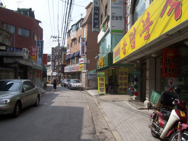 Susan walking to her office through our local shopping street.