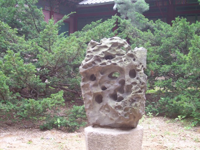 A "jade" decorates a garden nook.