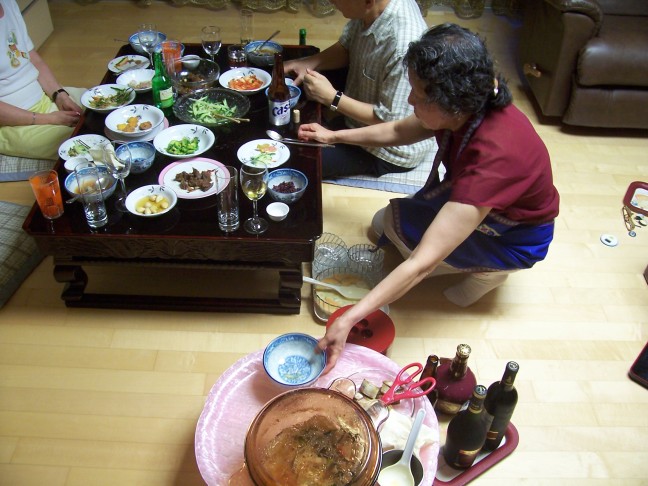 Mrs. Lee serving the delicious codfish soup.