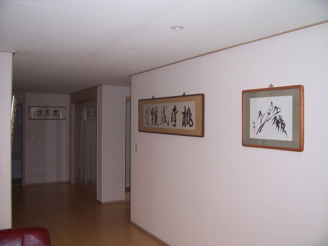 Paintings and calligraphy decorate the walls.