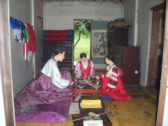 Here in the "prosperous farmer's house" at the Korean Folk Village, the family is sitting down to dinner.