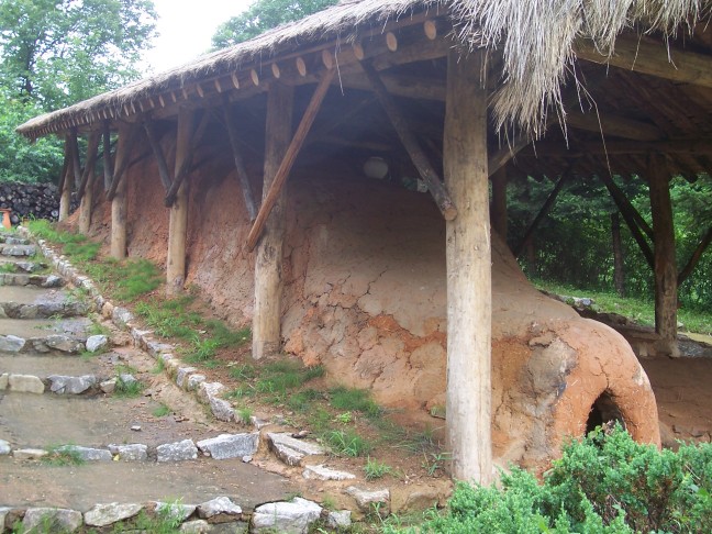 Kiln for pottery. A line of fires produces high temperature at the upper end.