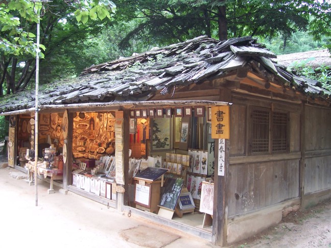 Traditional roofs sometimes have traditional problems. Note vegetation.