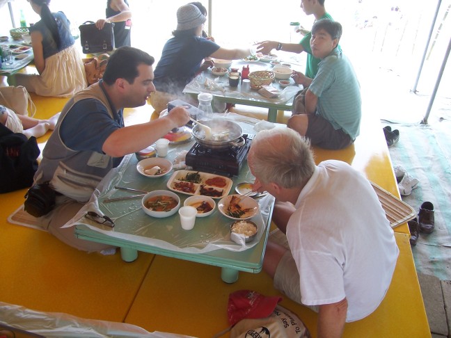 Lunch was fish stew. At left is a professor from the University of Pennsylvania. At right is Grant, a rancher from New Zealand.