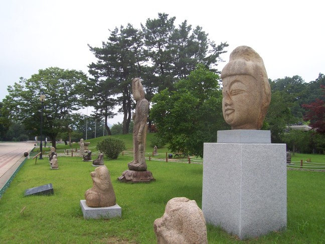 Buddhas and other statuary grace the entry lawn at the Gyeongju National Museum.