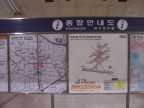  The left sign is a neighborhood map, with numbered exits clearly marked. The right sign is a 3-D rendering of the station.