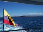  The civil flag of Ecuador seen astern as we head to Black Turtle Lagoon, Santa Cruz, Galapagos