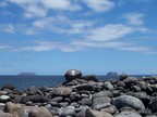  Daphne Major and Daphne Minor framed by rocks on the shore of Seymour Island, Galapagos