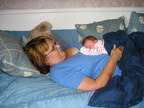  Grandma Bev cuddles her latest grandchild  