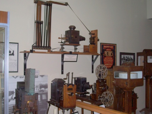 More early projectors. The one on the wall pre-dated the use of reels.