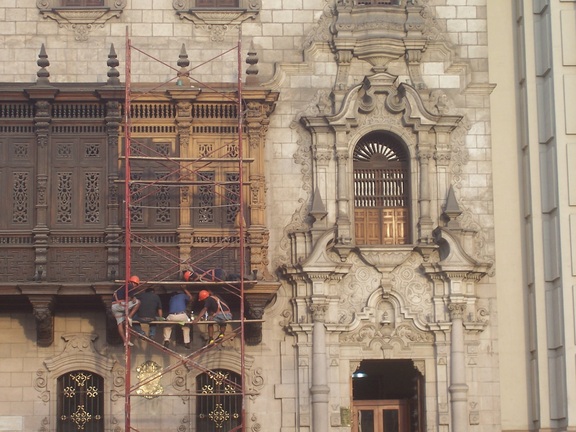 Painting a church, Plaza de Armas, Lima