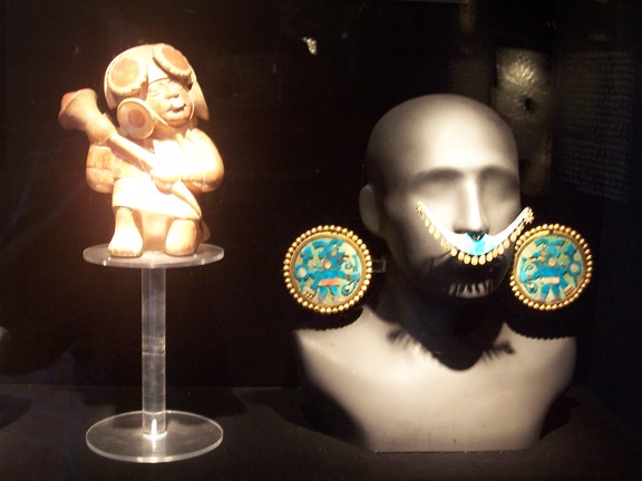 Inca gold: miniature warrior, full size nose and ear decorations. Uncomfortable? Larco Museum, Lima