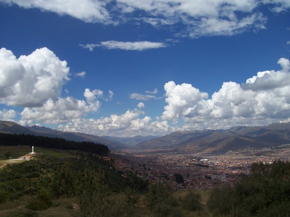 Cusco as seen looking south from Sacsayhuaman, the sun strikes Cristo Blanco on the left