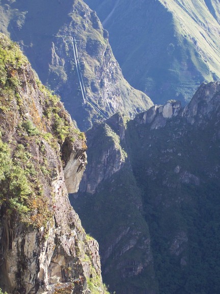 Shot of pipeline to village in valley, from guardian hut, Machu Picchu