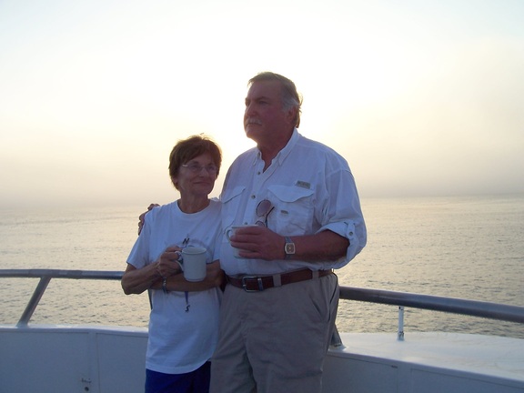 Rosemary and Bill enjoying their morning coffee in the bay at Sante Fe, Galapagos