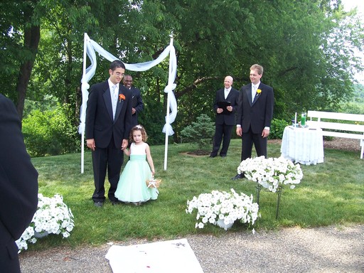 Receding flower girl and father