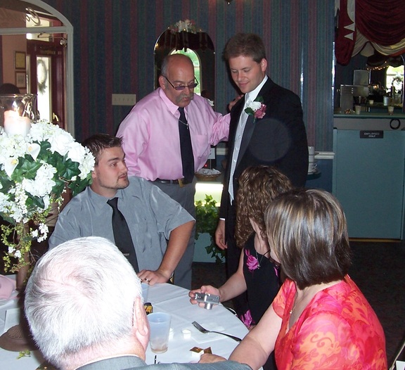 Uncle Robert and Brian standing; John Kara, and Brian's Mom Sally