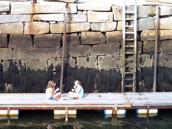 Two young ladies found some privacy to eat their yogurt in Rockport