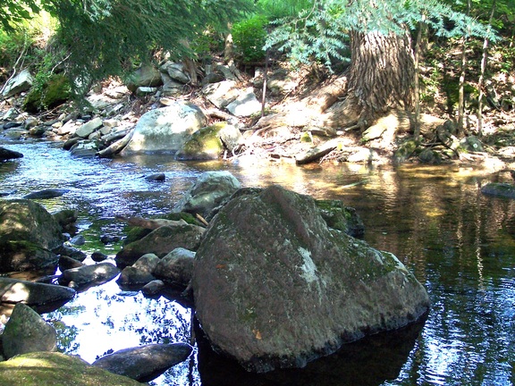 Downstream from the waterfall, Oak 'n Spruce resort