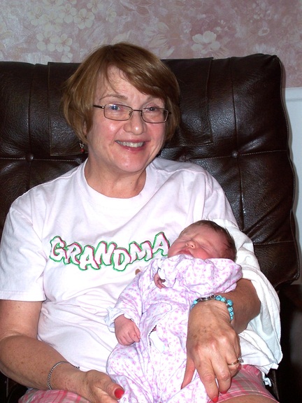 Proud grandma poses with her granddaughter