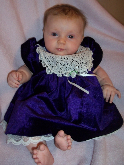 Formal portrait in a blue suede dress