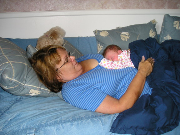 Grandma Bev cuddles her latest grandchild  