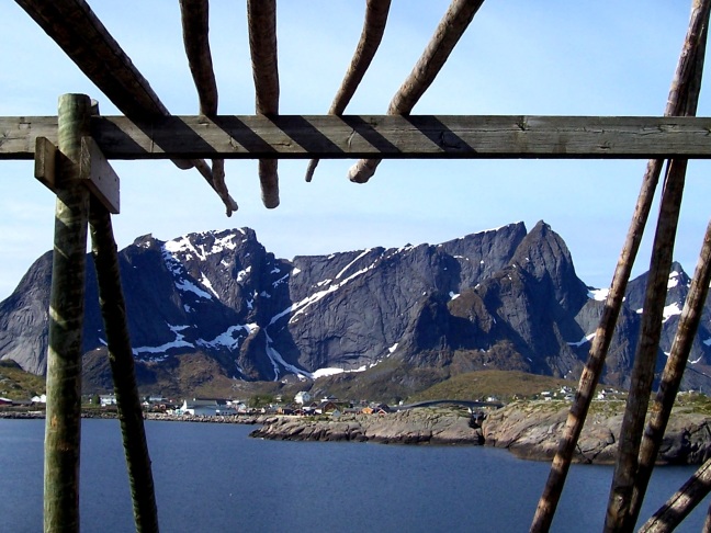 A Lofoten mountain shot from inside an unused cod drying rack