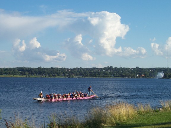 Dragon boat full of tourists, from Heritage Park, Barrie, Ontario