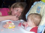    Ellyn shows a one-year-old Lindsay how to eat birthday cake
