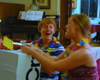    Devin and Ellyn opening a present at her shower