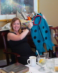    Tanya displays the froggie costume which has migrated throughout the family