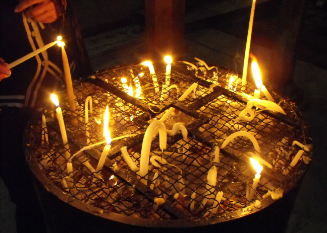  Lighting a candle in the Church of the Holy Sepulchre