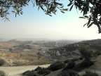  Looking east from Mount Scopus, a Palestinian town with a Jewish settlement beyond