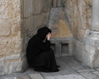  Nun praying at the entrance to the Church of the Holy Sepulchre