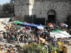  Crowds heading home for the holy days are greeted by vendors as they emerge from the Old City, Jerusalem