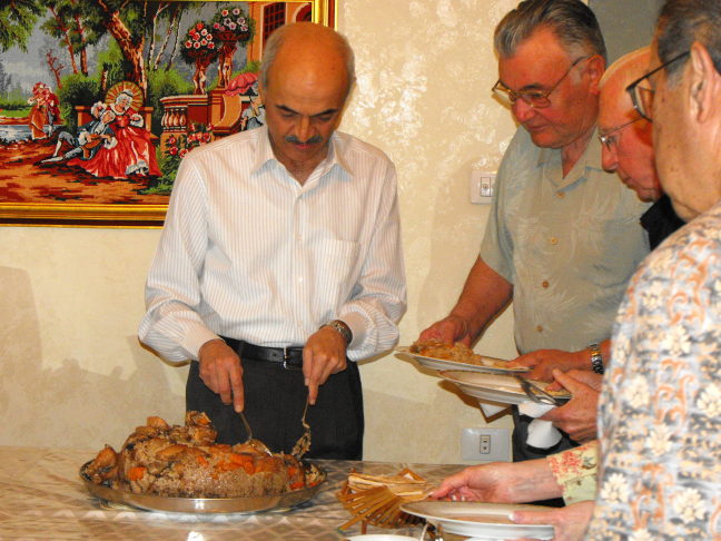  Serving the "Upside Down" chicken at our home visit, Amman