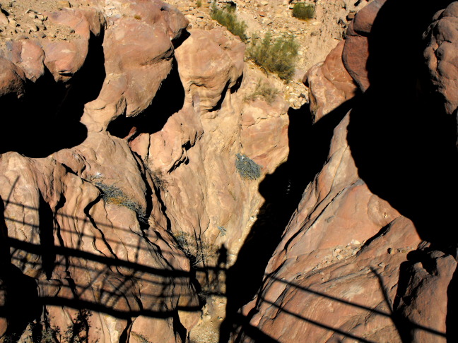  For tourists, a rickety bridge spans this ravine; Petra