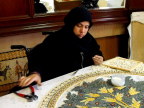  After nipping the tile to shape, the artist will dip it in the glue and tweeze it into place, Madaba