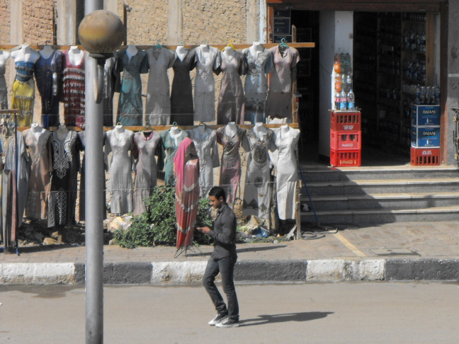  Walking past Coke and cloths, 11:03:32, Edfu