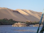  Sand dunes loom above the Nile just below the Aswan Dam