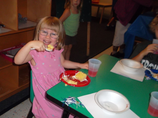  Eating cake at graduation from pre-school
