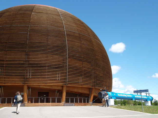  The dome at CERN houses a unique multimedia display of CERN's mission and accomplishments. The blue tube is a section of the CERN accelerator ring. There are 9000 like it in the ring. It is curved by 2 millimeters.