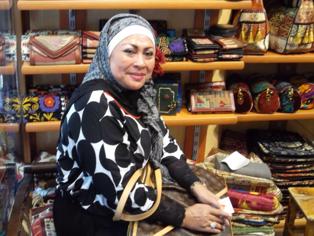  Mom helping her daughter buy leather boots in Istanbul