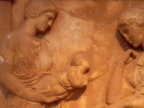  Presenting a baby to its mother, bas relief in the National Museum, Athens