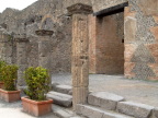  Steps, columns, and a decorated wall in Pompei, dug out of the ash that fell in 79 AD