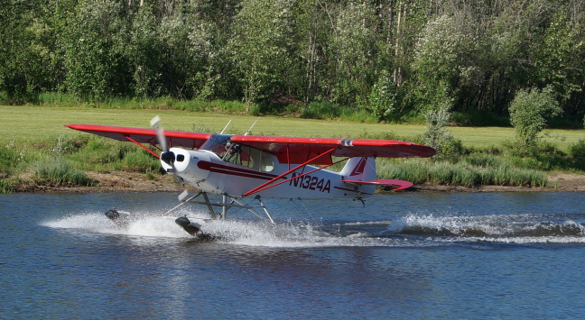  Seaplane showing off for the Riverboat Discovery tour on the Chena River near Fairbanks